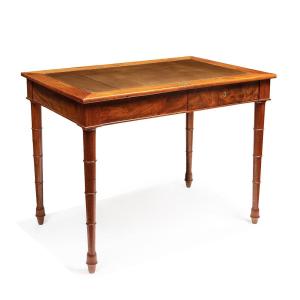 UNE TABLE D’ÉPOQUE EMPIRE PROVENANT DU PALAIS-ROYAL EN ACAJOU