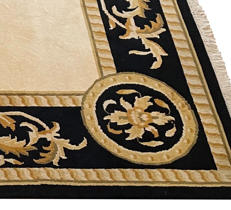 Large Hand Knotted Rug With A Wide Black And Gold Border And A Large Central Colored Field -photo-3