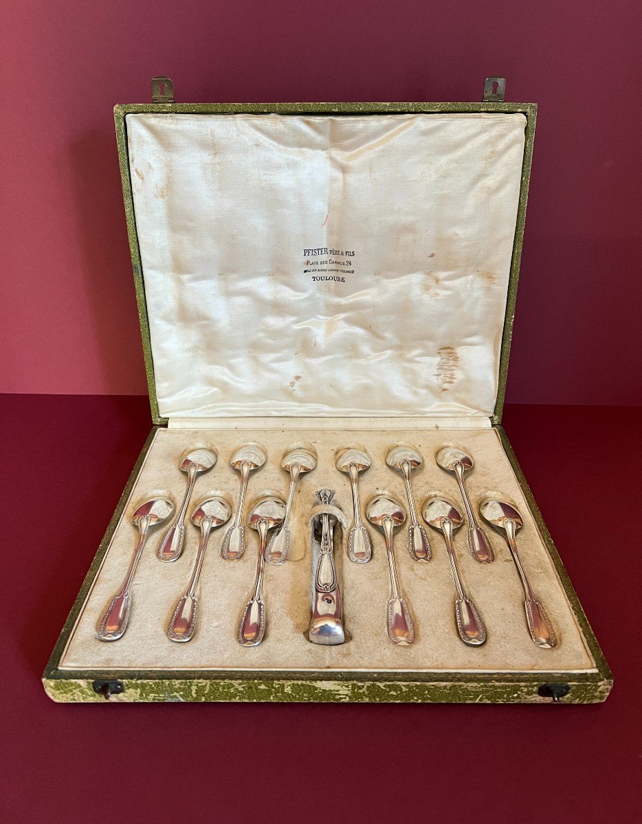 Set Of 12 Silver Teaspoons And Sugar Tongs In Its Original Box. 