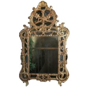 A Louis XV Mirror, With Attributes Of The Goddess Artemis, Mid 18th Century.