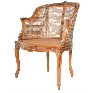 Fauteuil bergère canné de style Louis XV 