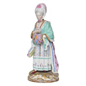 Statuette en porcelaine de Meissen représentant Dame au manchon lisant une lettre.  Modèle D66 