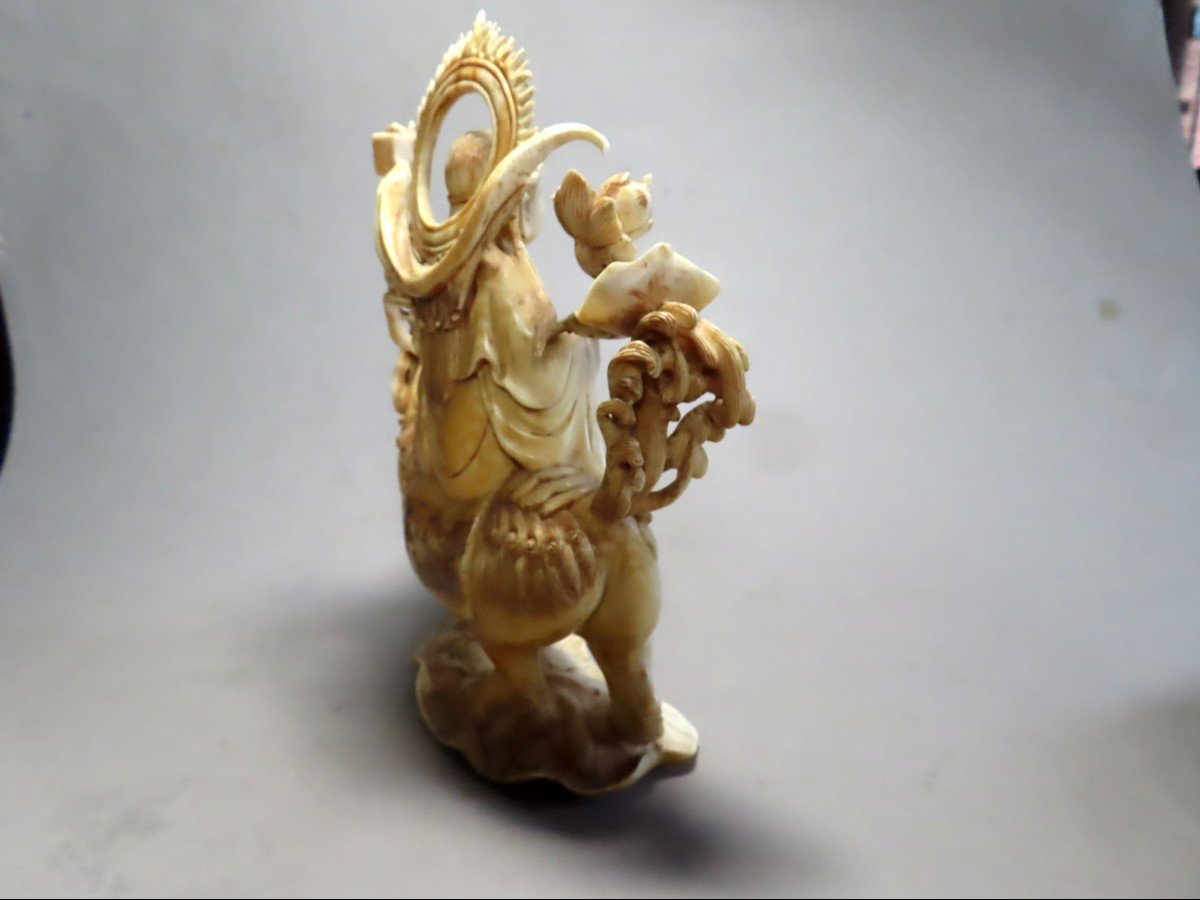 Ivory Okimono. Deity On An Fö Dog. China 1920-30.-photo-1