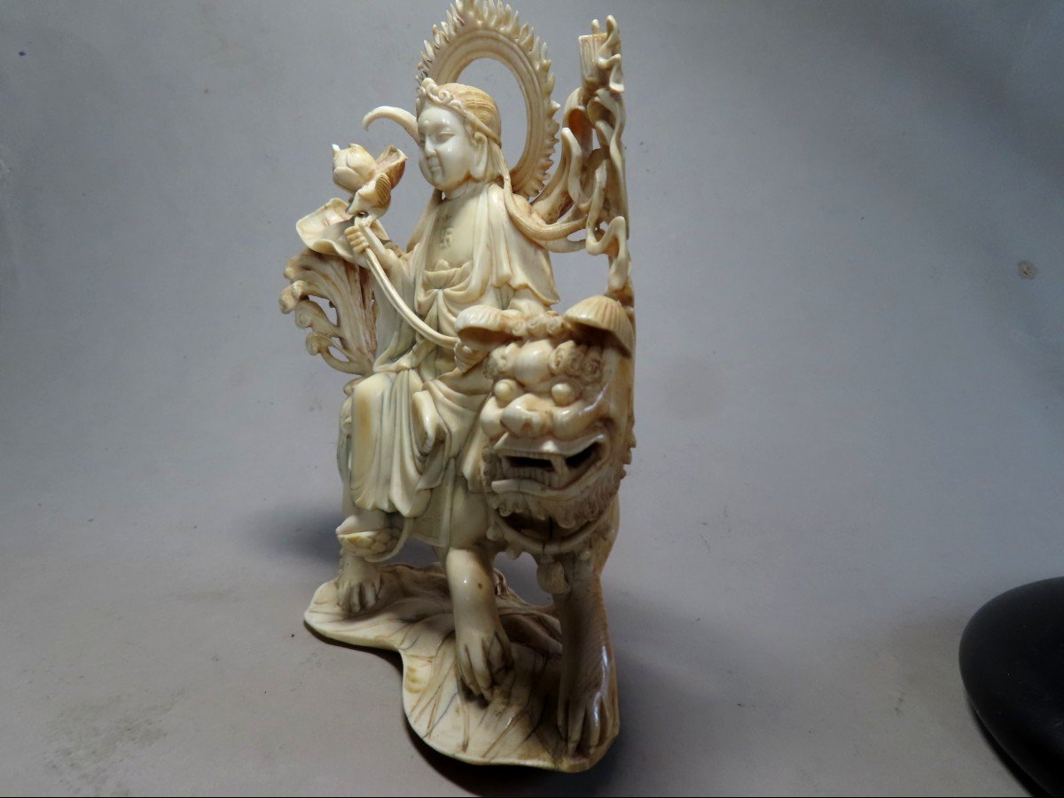 Ivory Okimono. Deity On Shishi. China 1920-30.-photo-2