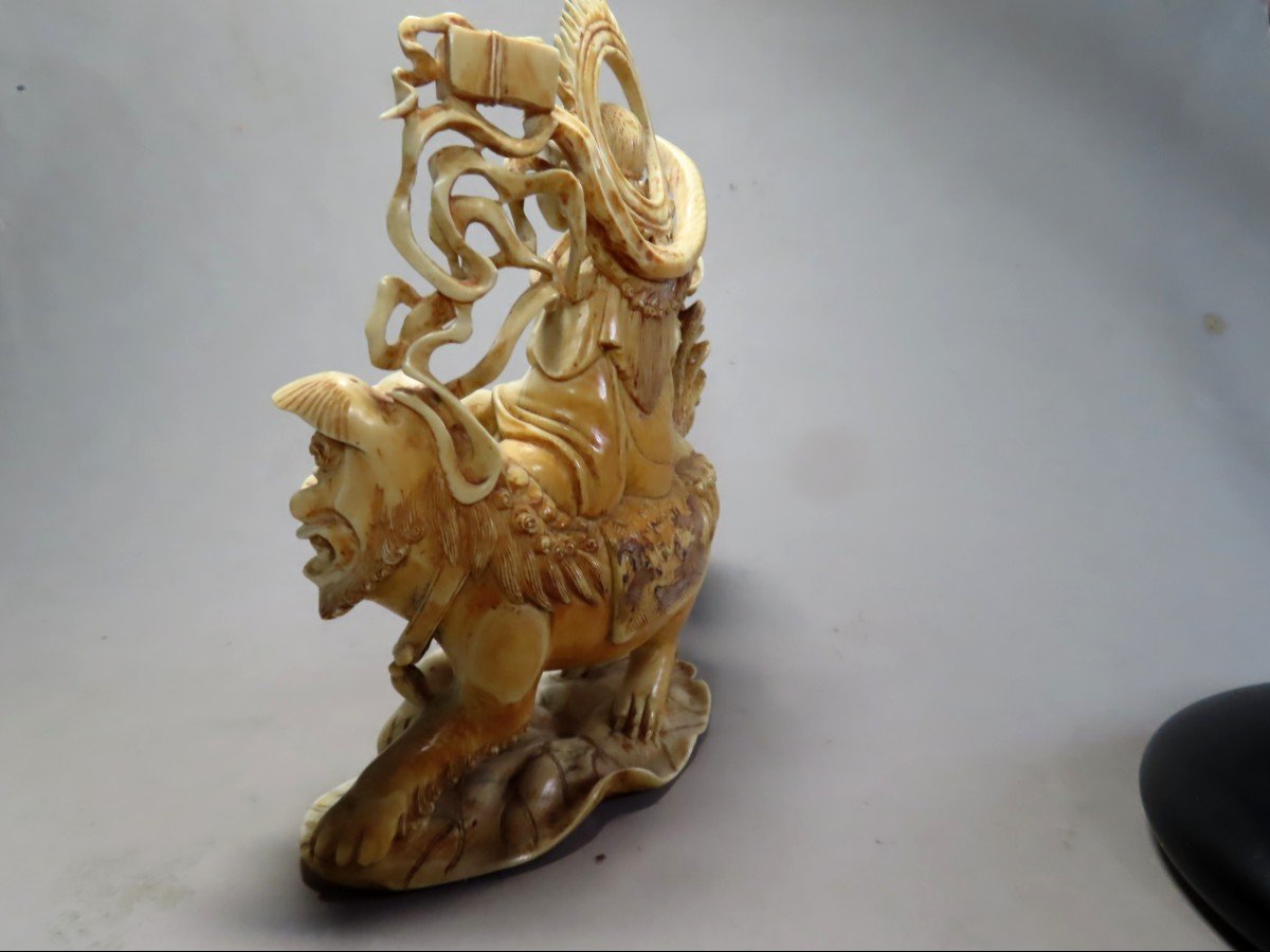 Ivory Okimono. Deity On Shishi. China 1920-30.-photo-3