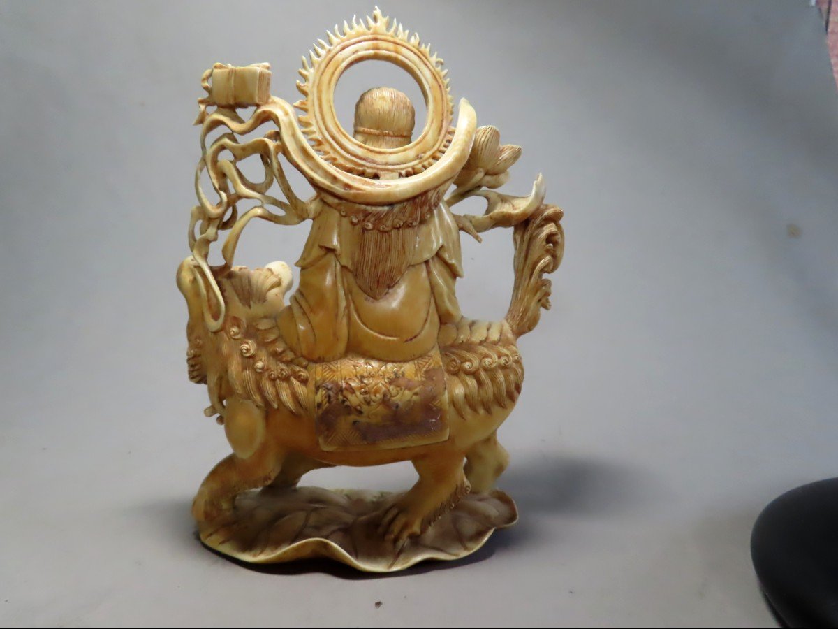 Ivory Okimono. Deity On Shishi. China 1920-30.-photo-4