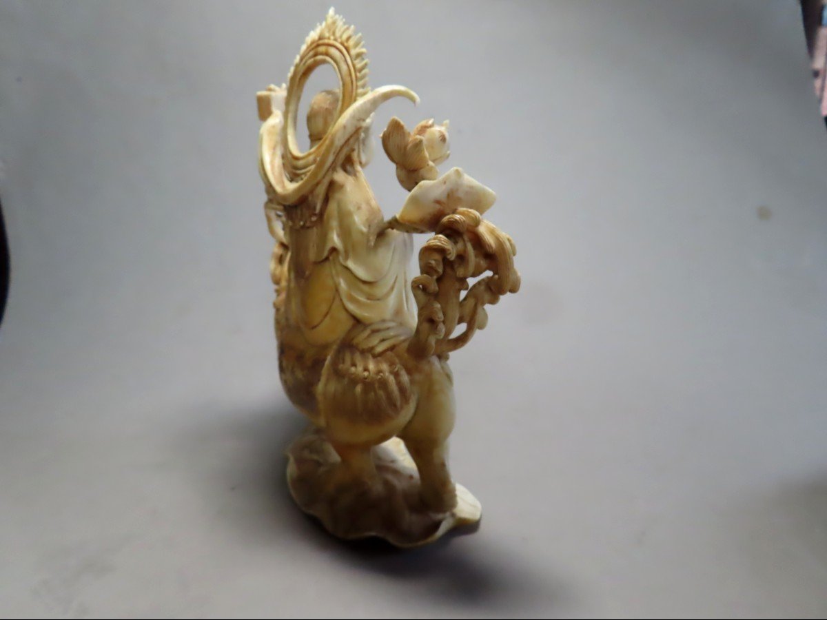 Ivory Okimono. Deity On Shishi. China 1920-30.-photo-1