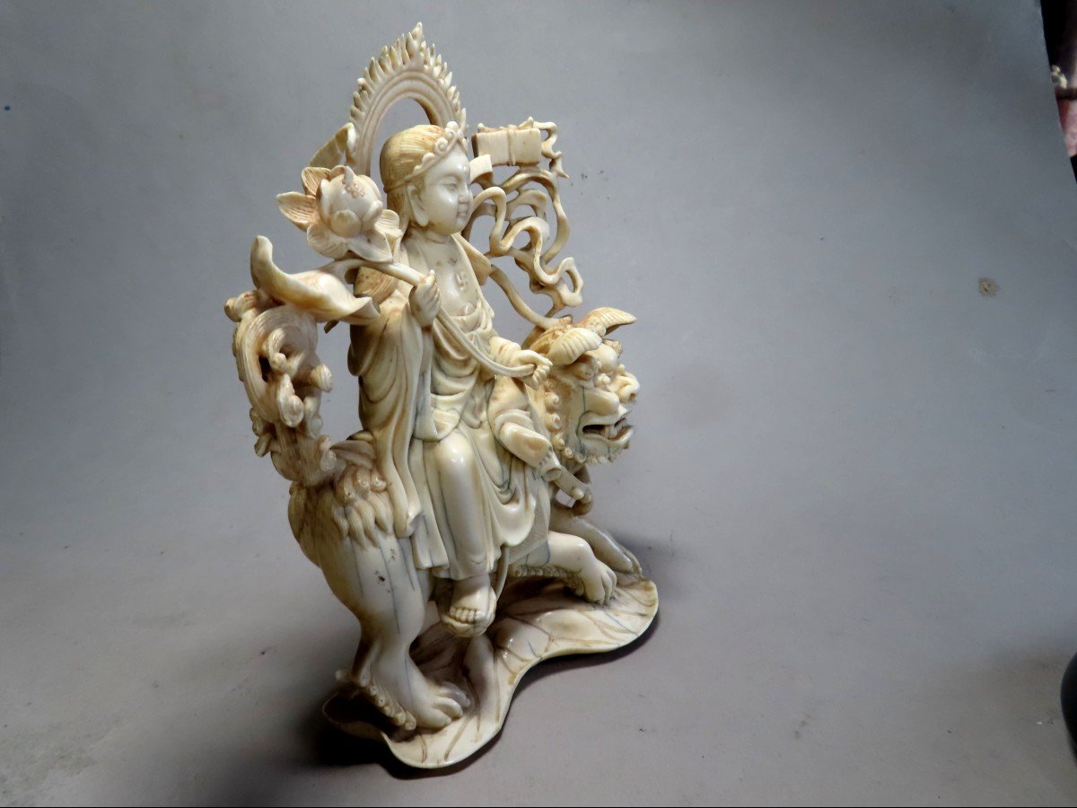 Ivory Okimono. Deity On Shishi. China 1920-30.-photo-2