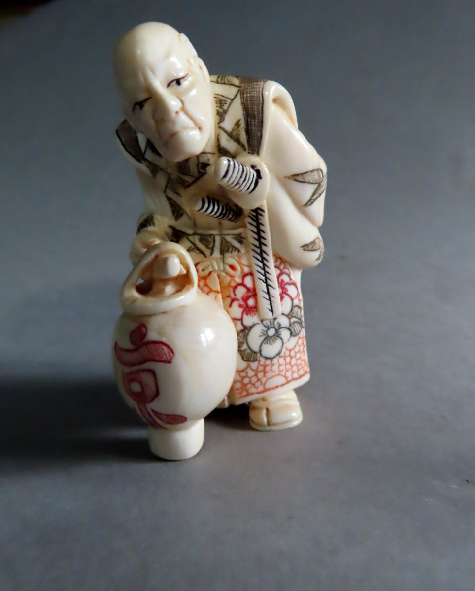 Ivory Okimono. Old Samurai With Lantern. Japan Taisho Period (1912-1928)