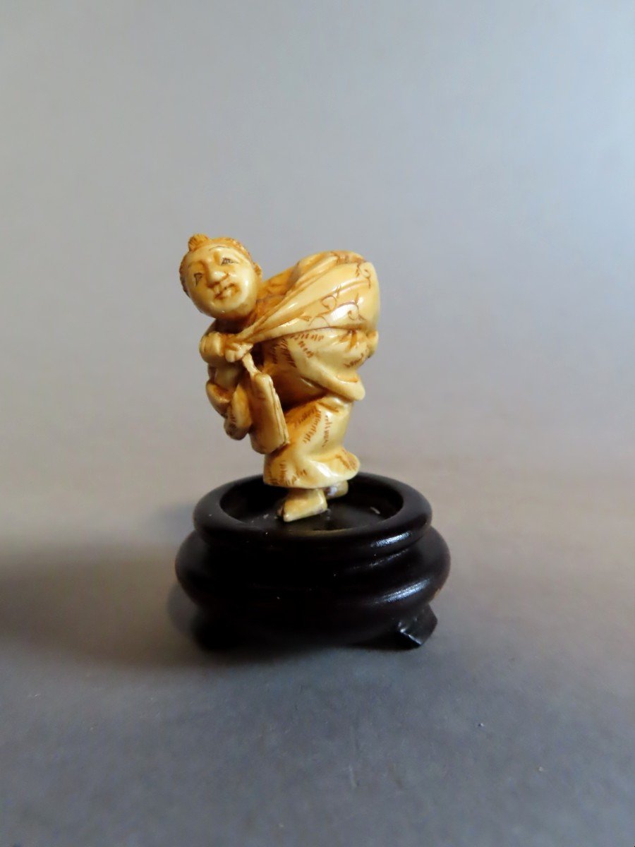 Ivory Netsuke. Young Peasant Girl With A Bundle. Japan, Meiji Period (1868-1912)