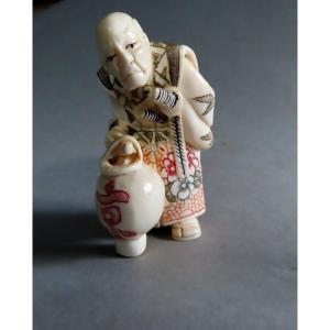 Ivory Okimono. Old Samurai With Lantern. Japan Taisho Period (1912-1928)