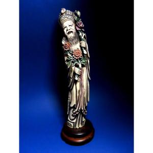 Ivory Okimono. Old Notable With Flowers. China 1920-30.