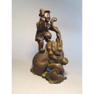 Okimono en bronze. Elephanteau , son cornac et un karako. Japon époque Meiji (1868-1912 )