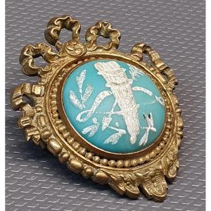 Broche en bronze et faience