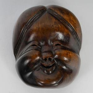 Wooden Netsuke Of A Japanese Okame Mask