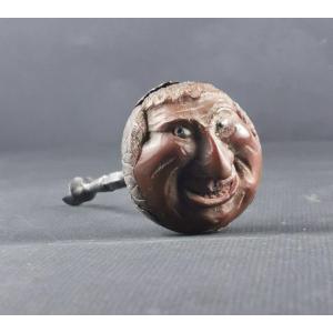 Grotesque Carved In A Brown Forming Corkscrew