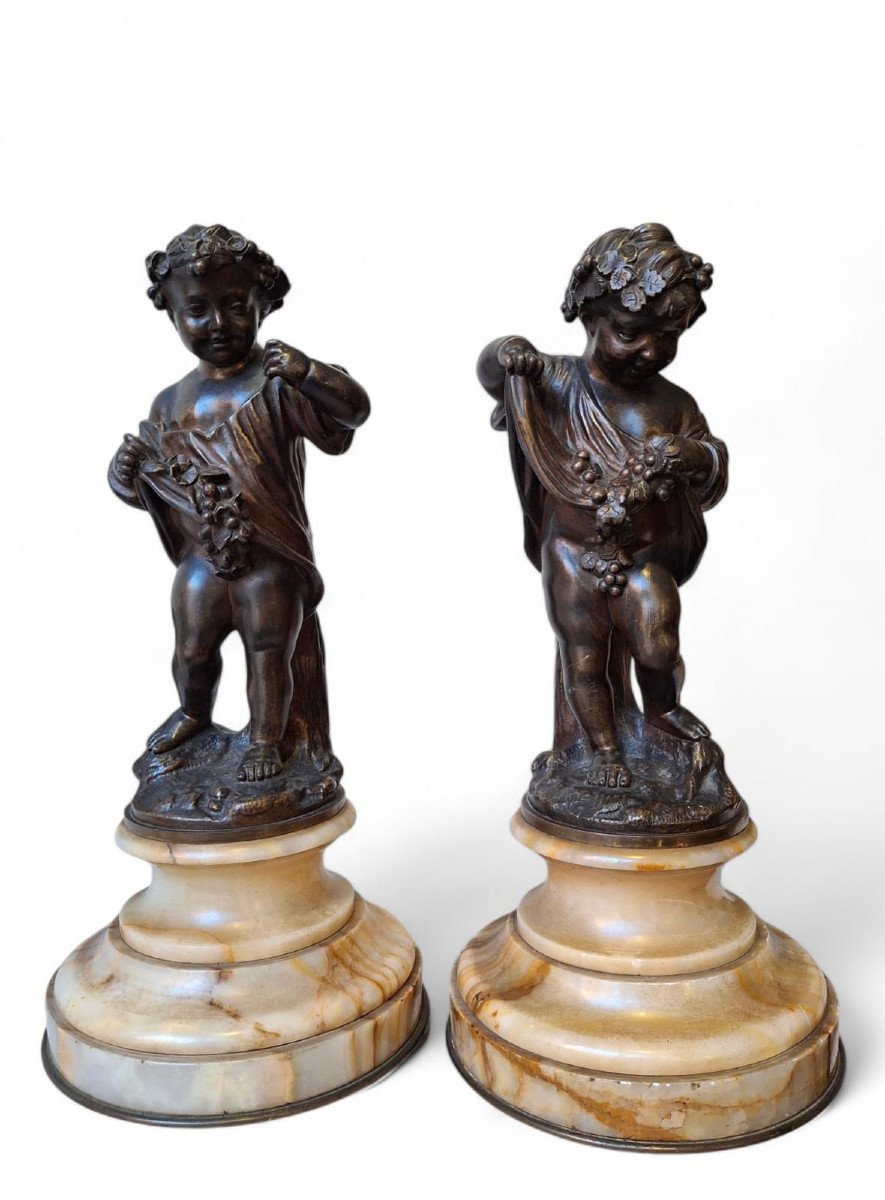 Pair Of Chiseled Bronze Putti