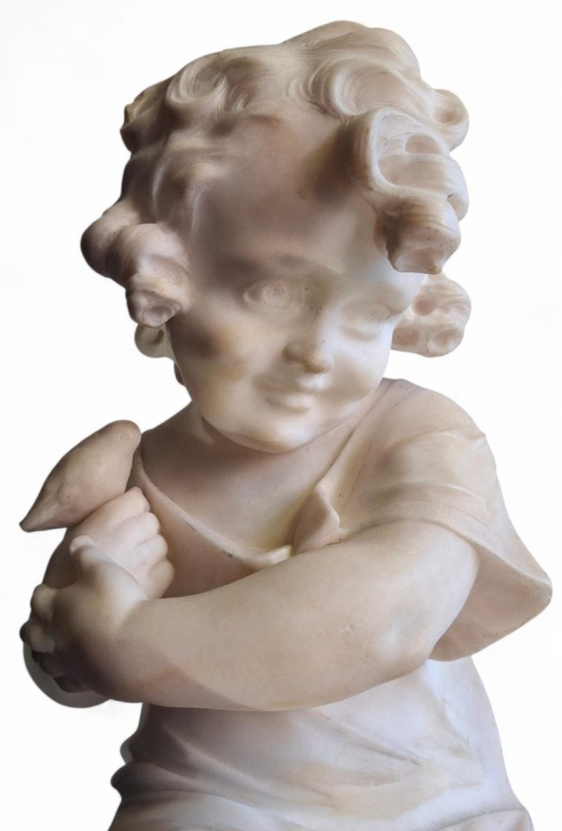 Sculpture Depicting A Little Girl With A Bird-photo-2