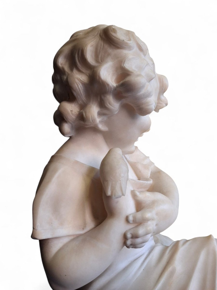 Sculpture Depicting A Little Girl With A Bird-photo-4