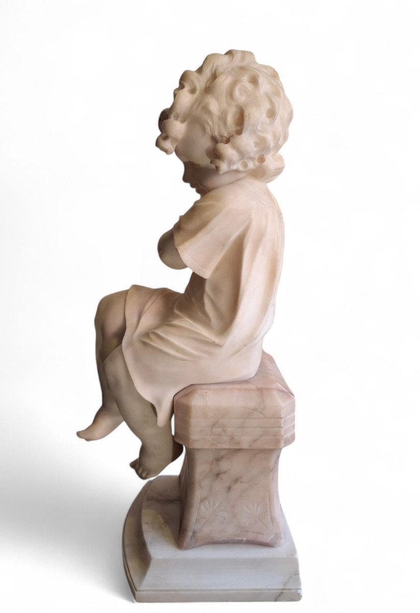 Sculpture Depicting A Little Girl With A Bird-photo-2