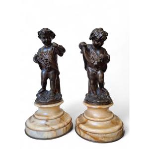 Pair Of Chiseled Bronze Putti