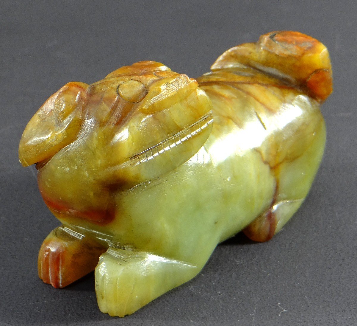 China, First Half Of The 20th Century, Small Buddhist Lion Statuette In Carved Jade. -photo-2