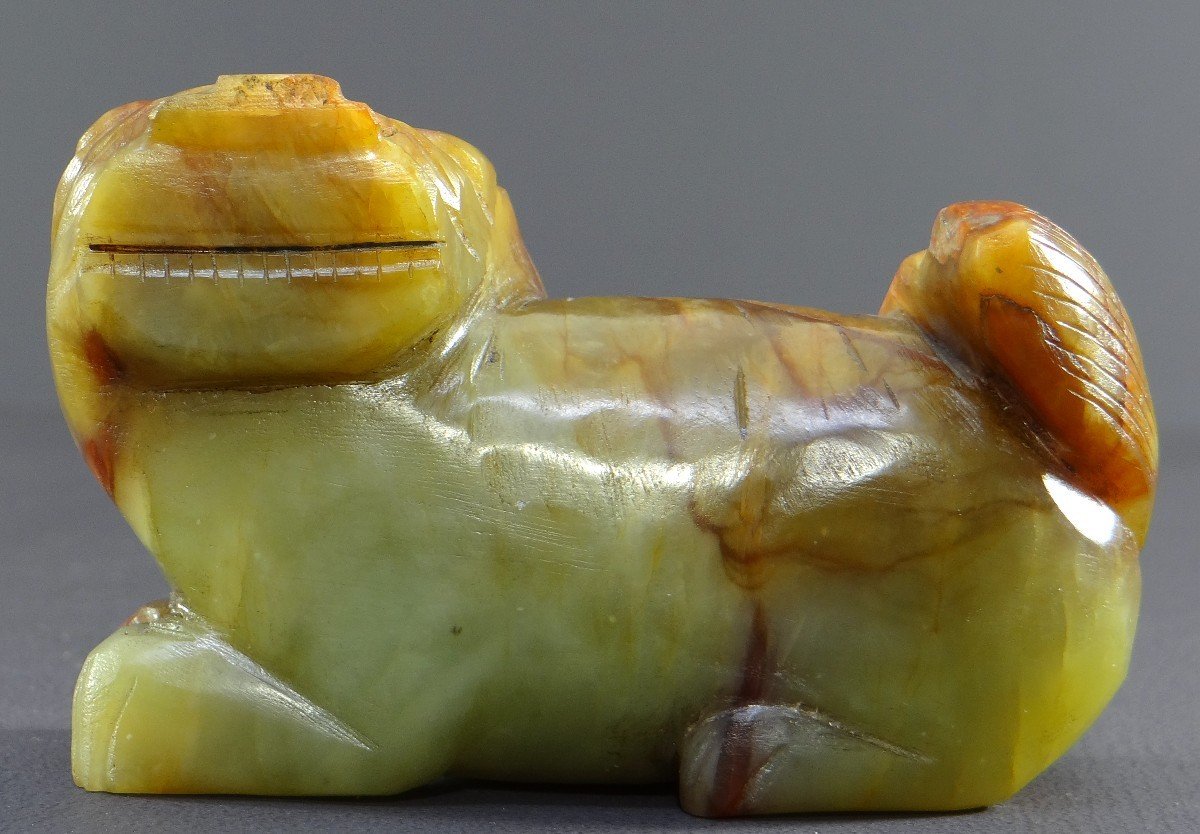 China, First Half Of The 20th Century, Small Buddhist Lion Statuette In Carved Jade. -photo-3