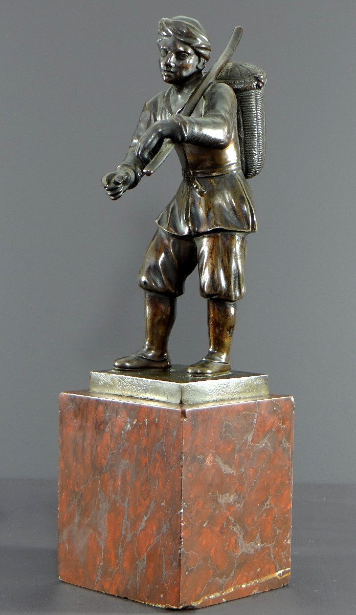 Italy, 18th Century, Bronze Statue Representing A Basket Carrier On A Marble Base.