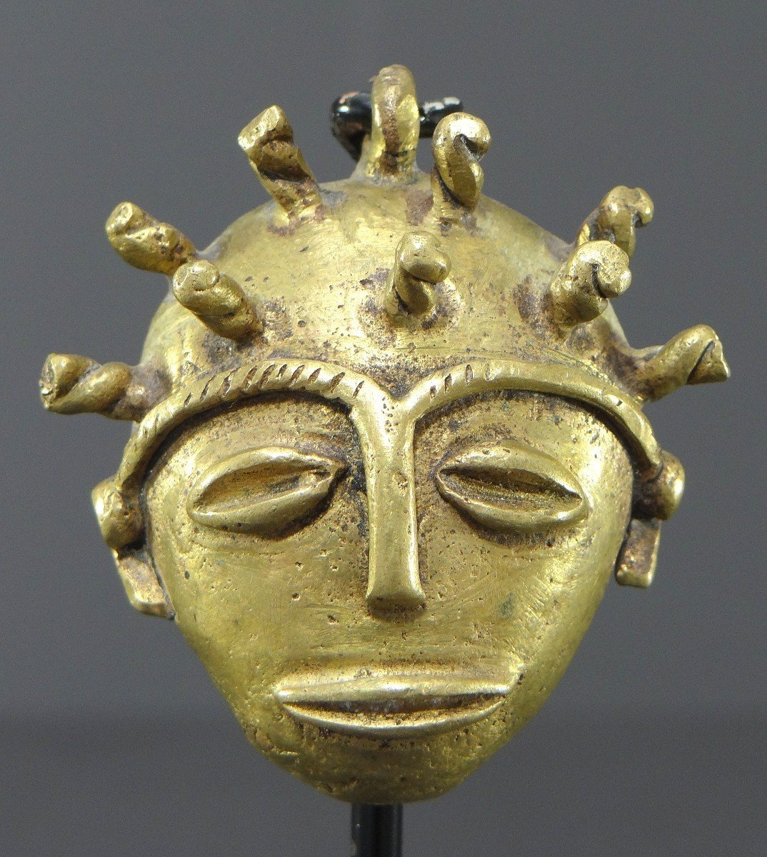 Ivory Coast, Baoulé People, 1950s/1960s, Miniature Anthropomorphic Bronze Mask.