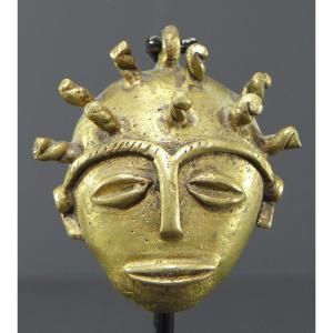 Ivory Coast, Baoulé People, 1950s/1960s, Miniature Anthropomorphic Bronze Mask. 