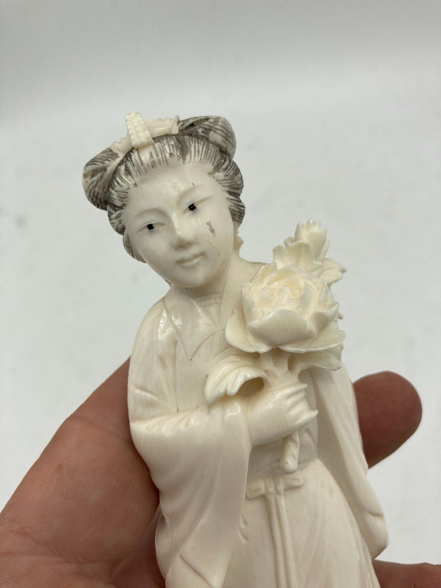 Ivory Sculpture Representing A Young Woman-photo-1