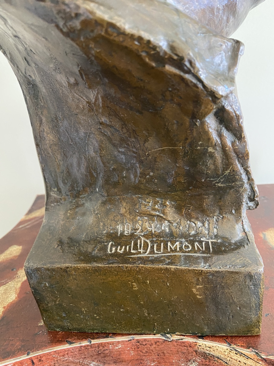 Bronze Sculpture Of A Man's Head With A Bun-photo-3