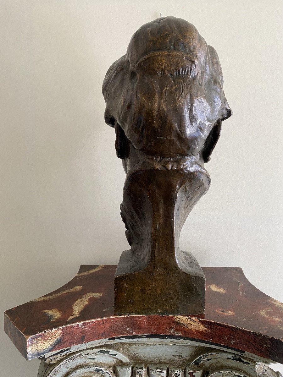 Bronze Sculpture Of A Man's Head With A Bun-photo-2