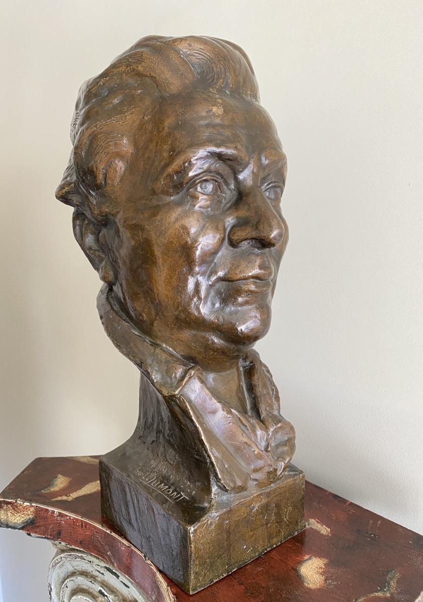 Bronze Sculpture Of A Man's Head With A Bun