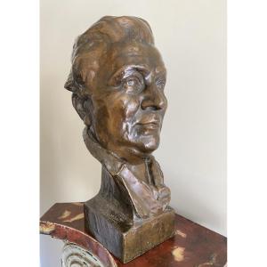 Bronze Sculpture Of A Man's Head With A Bun