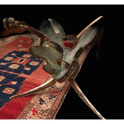 Table With Three Bronze Violins And Broken Glass