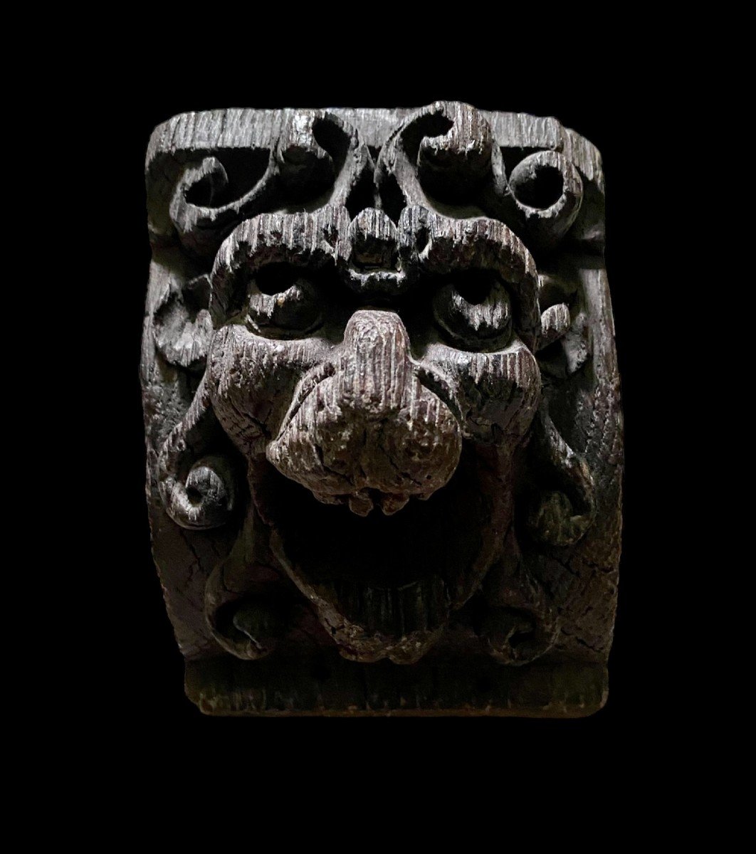 A Lion Head Corbel In Oak, 16th Century