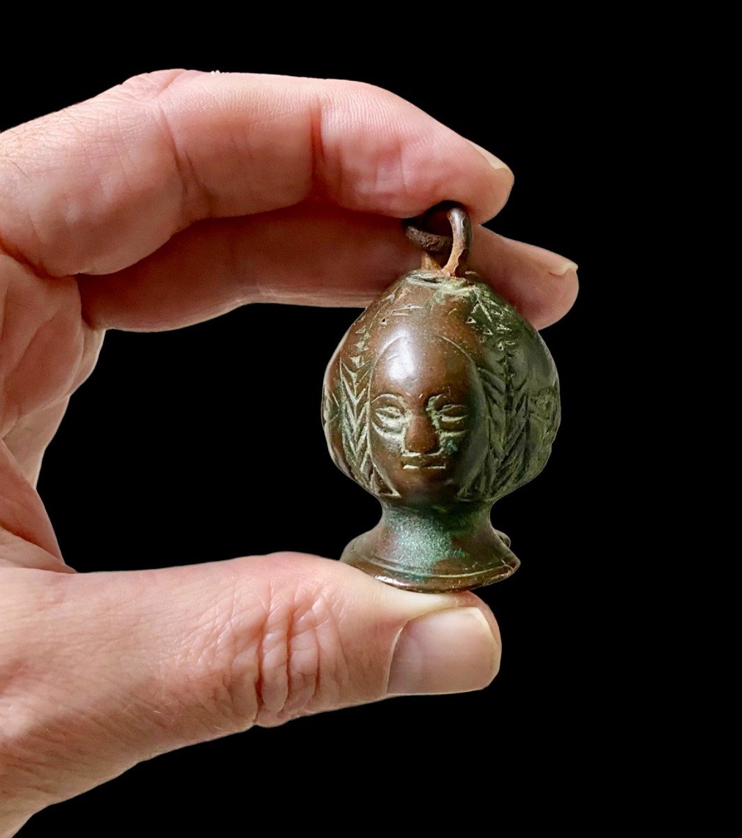 A 15th Century Sword Pommel With 4 Women's Faces