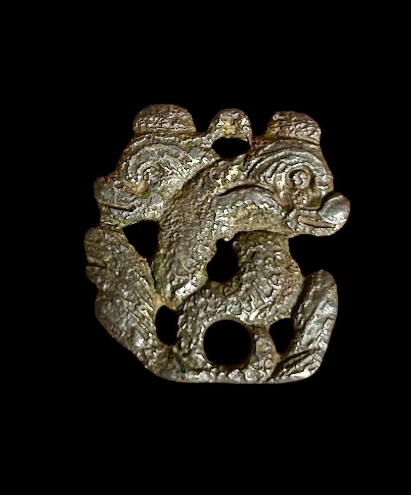 A Pendant With Dolphin-like Sea Creatures, 16th Century Or Earlier